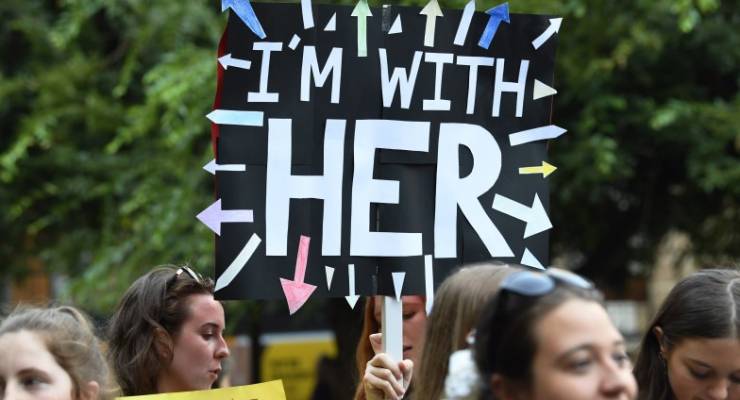International women's day rally gender inequality wage gap