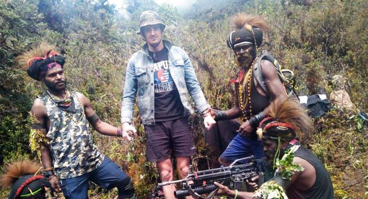NZ pilot Philip Mehrtens and Papuan separatist fighters (Image: Supplied)