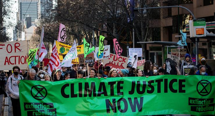 Environmental activists march towards Parliament House in Melbourne (Image: AAP/Diego Fedele)