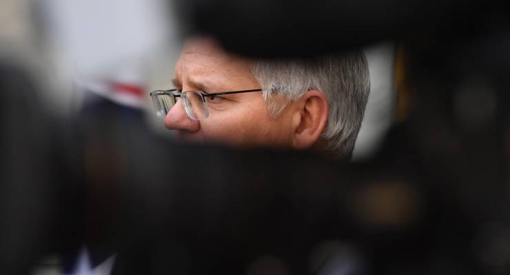 Scott Morrison standing at a press conference