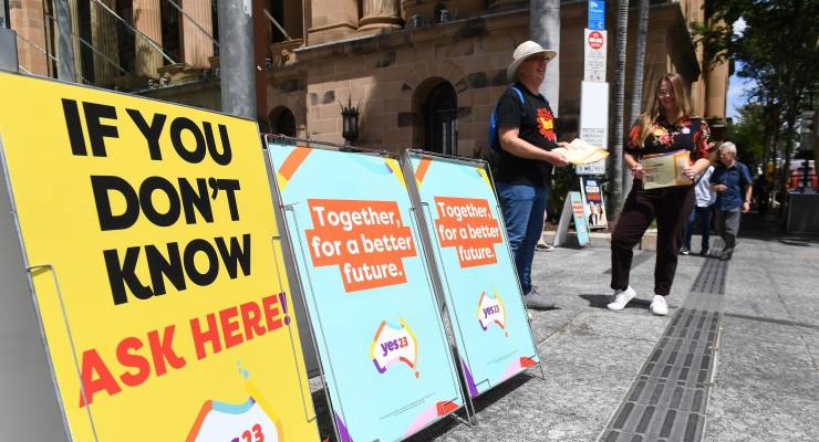 Yes posters at a polling station (Image: AAP/Jono Searle)