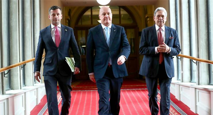 (L-R): ACT leader David Seymour, NZ Prime Minister-elect Christopher Luxon, and NZ First leader Winston Peters (Image: AAP/Mark Mitchell/NZ Herald/AP)