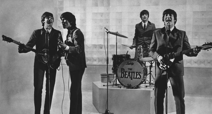 The Beatles performing on stage (Image: AAP/AP)