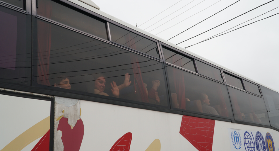 Teary scenes as a bus departs to Romania from Moldova on Friday (Image: Amber Scultz/Private Media)